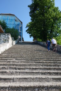 grooms must carry their brides up the 99 steps to the church on Lake Bled